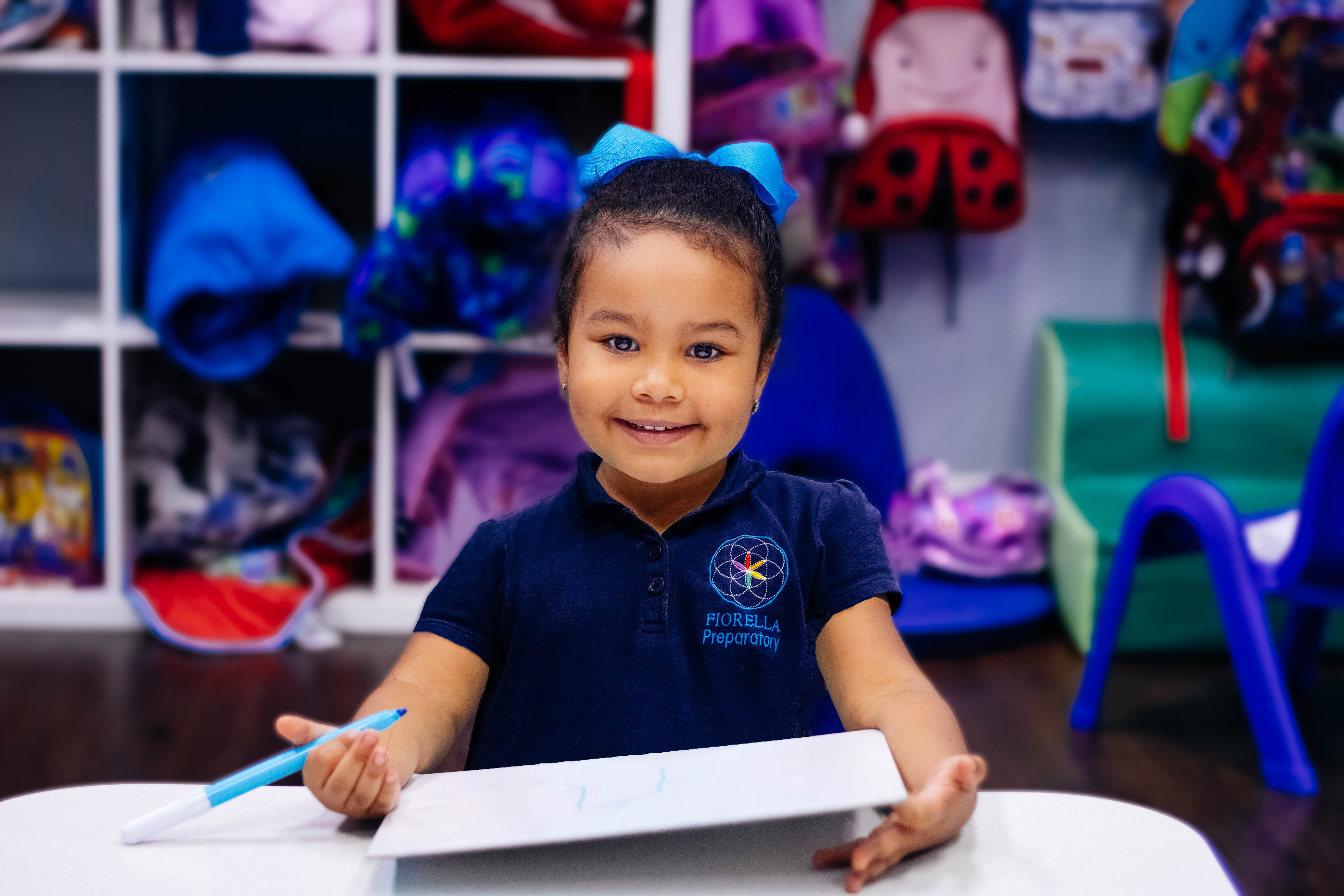 Preschool girl smiling and holding marker-2